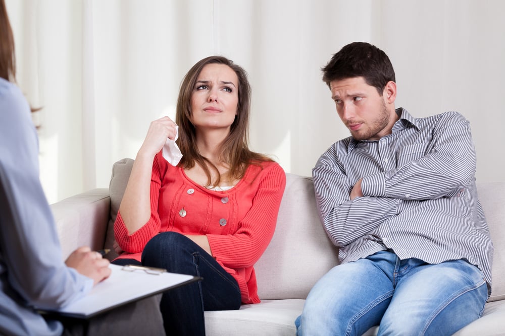Young unhappy couple on special marriage therapy session
